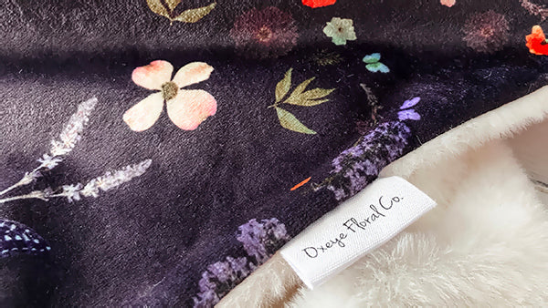 Dainty throw blanket with pressed floral print