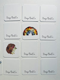 Set of Oxeye Floral Co. branded cards with floral designs on a white background