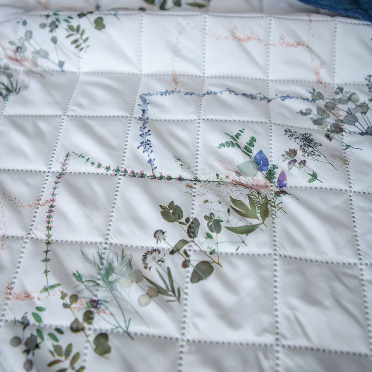 Camping blanket with floral mountain patterns on a white background