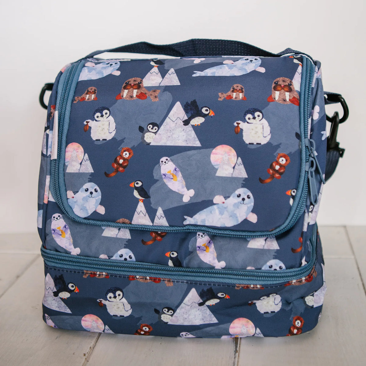 Blue lunch bag with flower arctic animal pattern by Oxeye Floral Co
