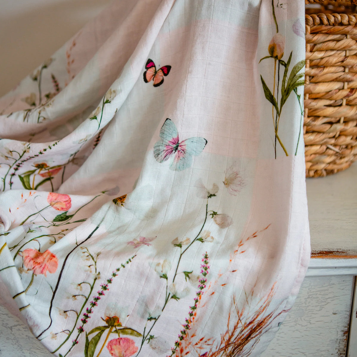 Pressed flower and butterfly swaddle by Oxeye Floral Co