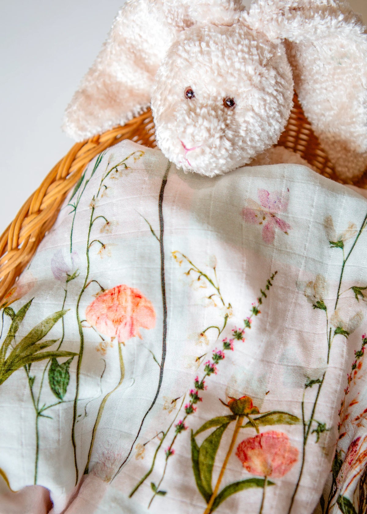 Newborn swaddle with pink flowers