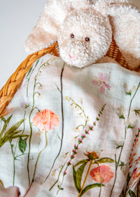 Newborn swaddle with pink flowers