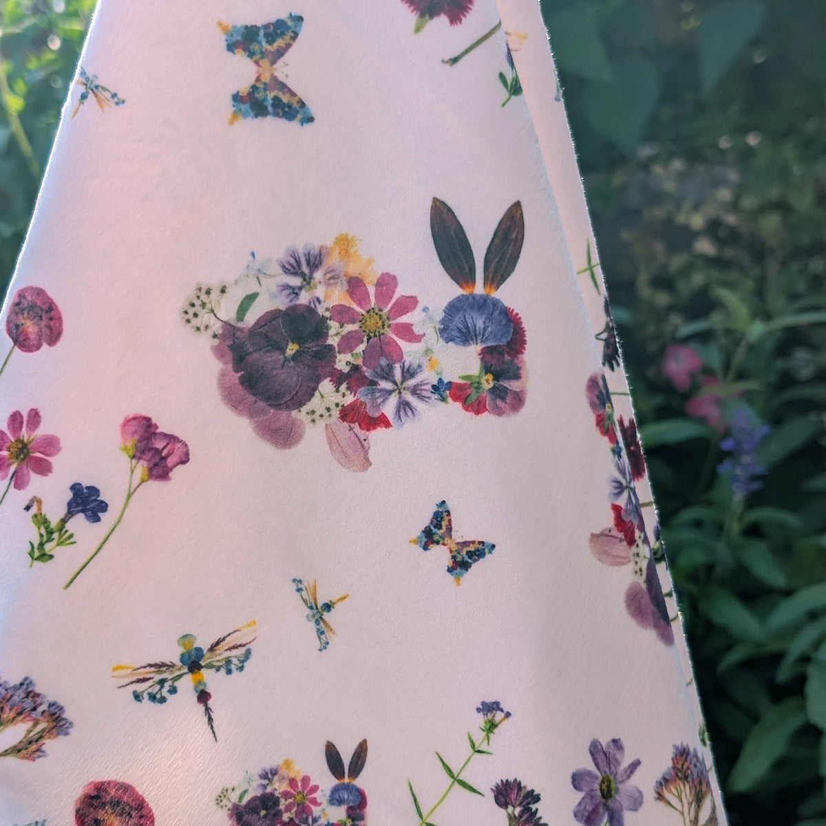 Flowery garden bunny and butterfly pattern on a white background