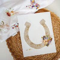 Horse shoe made from pressed flowers