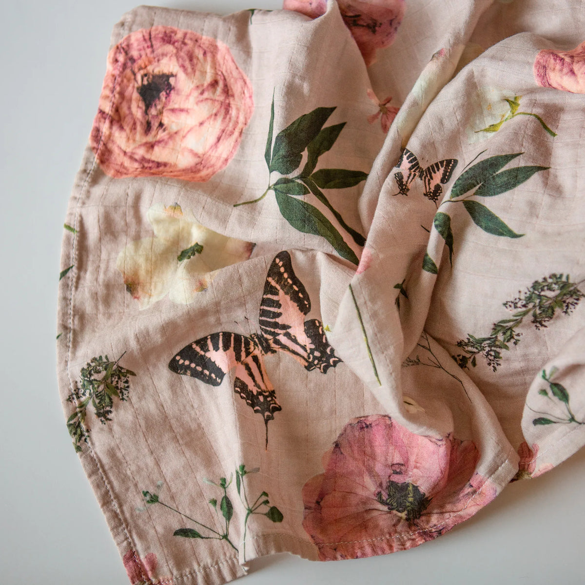 Girly pink baby swaddle with flowers and butterflies