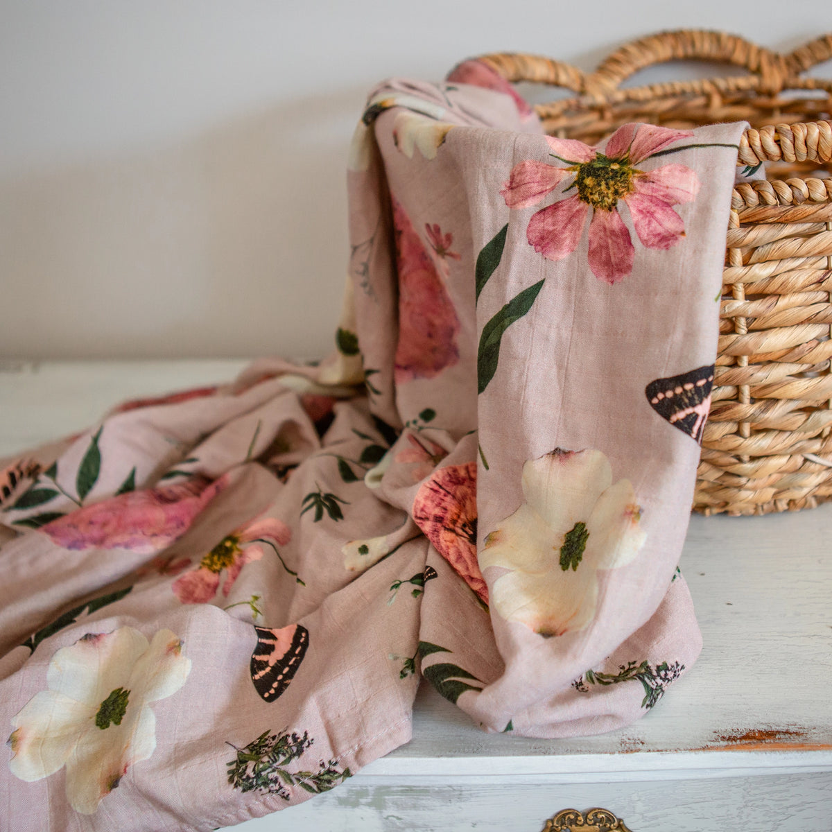 Pink butterfly muslin swaddle with pressed flowers by Oxeye Floral Co