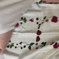 Adorable ladybug baby swaddle by Oxeye Floral Co