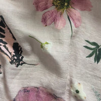 Pink floral muslin swaddle with pressed flowers