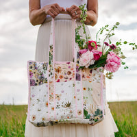 Woman holding patchwork whimsical girly tote