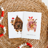 Christmas Chicken Butt and Jingle Pig Greeting Cards by Oxeye Floral Co