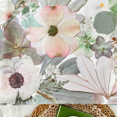Floral print blanket with pressed flower design