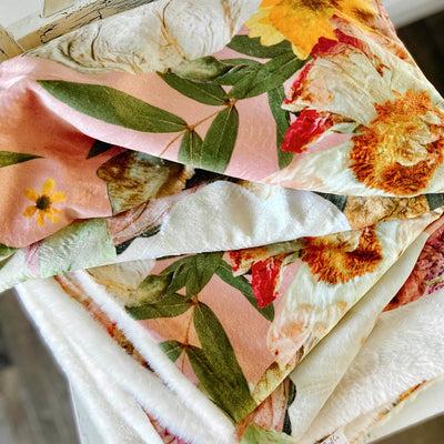 Peach throw blanket with flower design