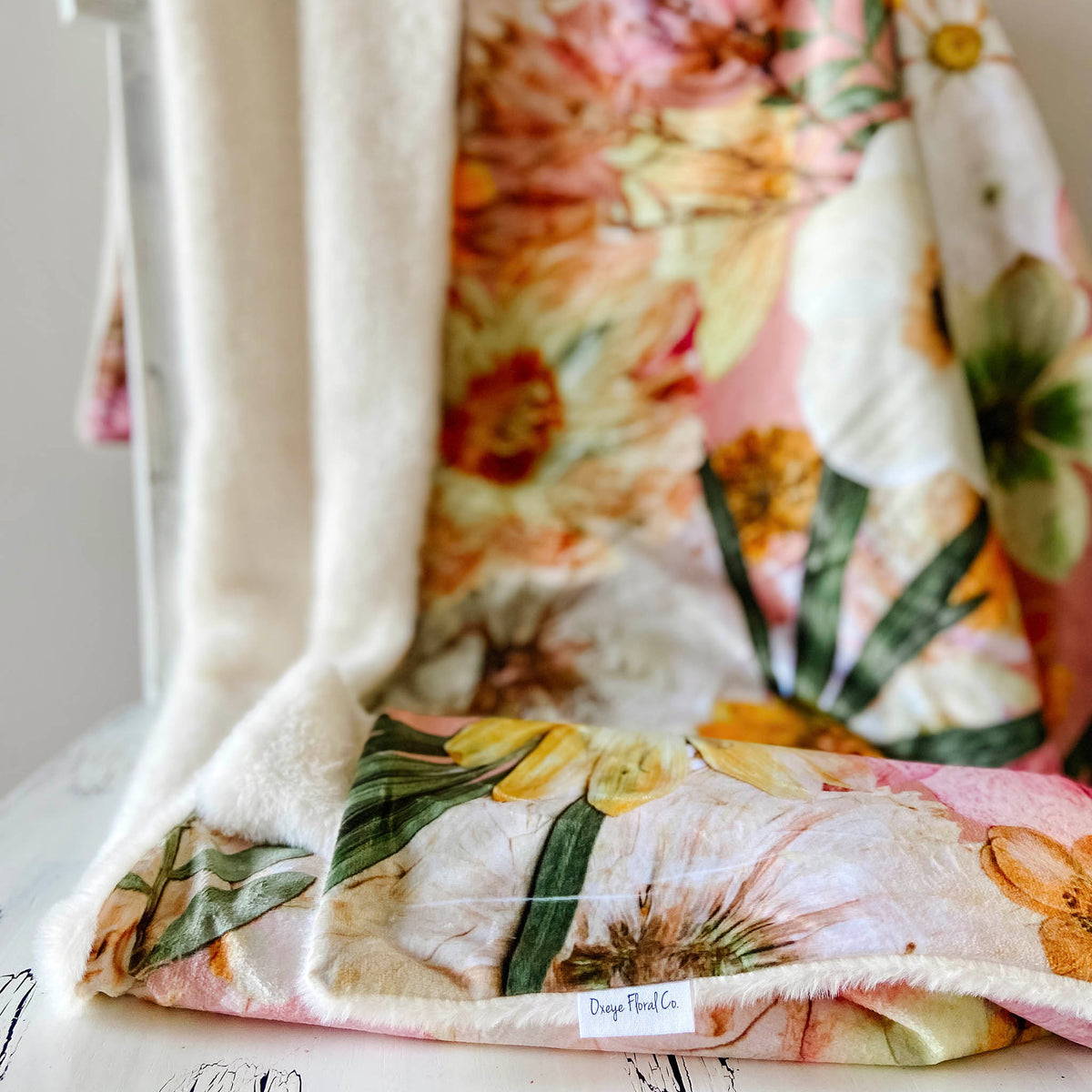 Luxurious throw blanket with pressed flower print by Oxeye Floral Co