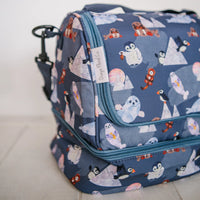 Closeup of Arctic Cuties pressed flower animal design on an insulated lunch box