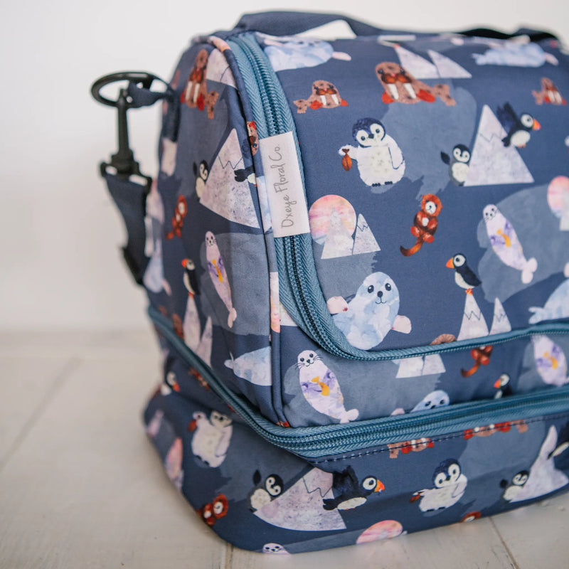 Closeup of Arctic Cuties pressed flower animal design on an insulated lunch box