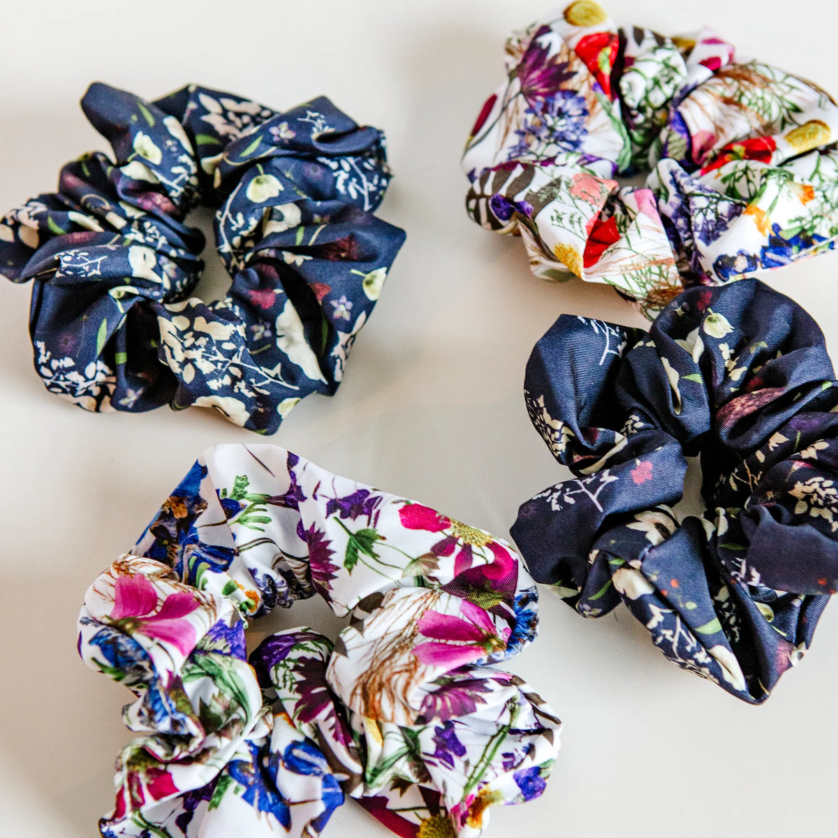 Set of floral scrunchies on a light background