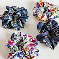 Set of floral scrunchies on a light background