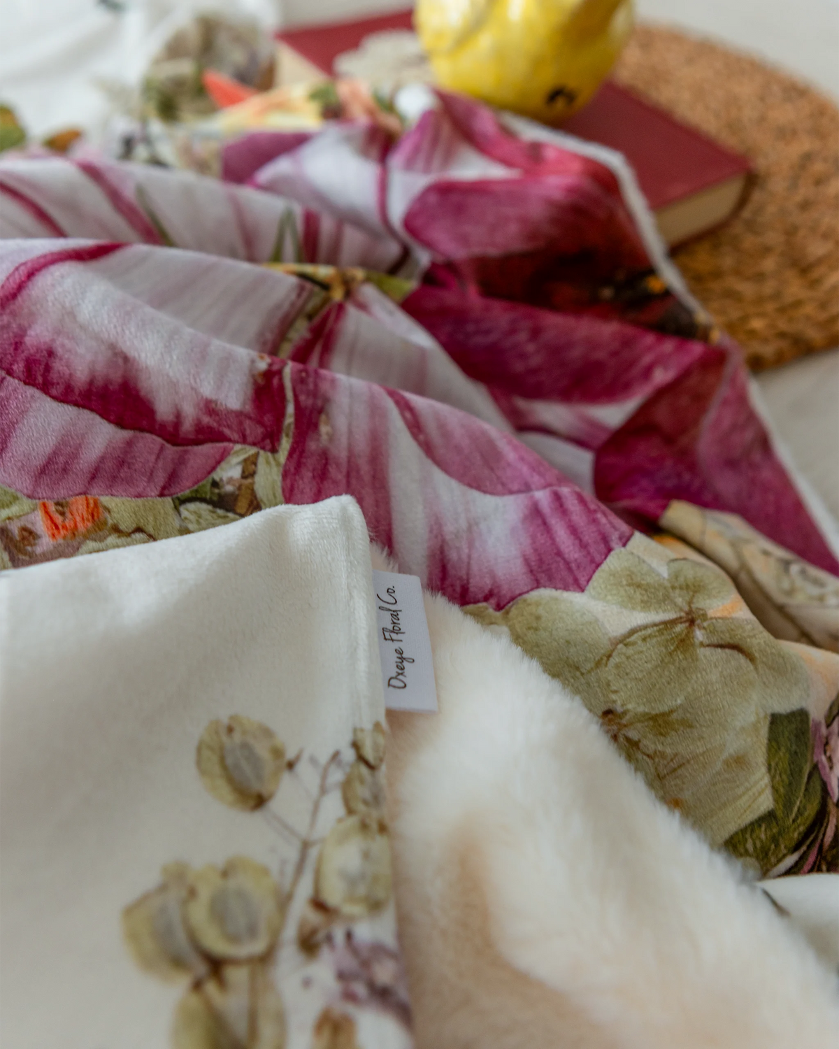 Floral blanket with fluffy backing and Oxeye Floral Co tag