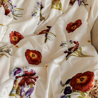 White throw blanket with pressed flower design