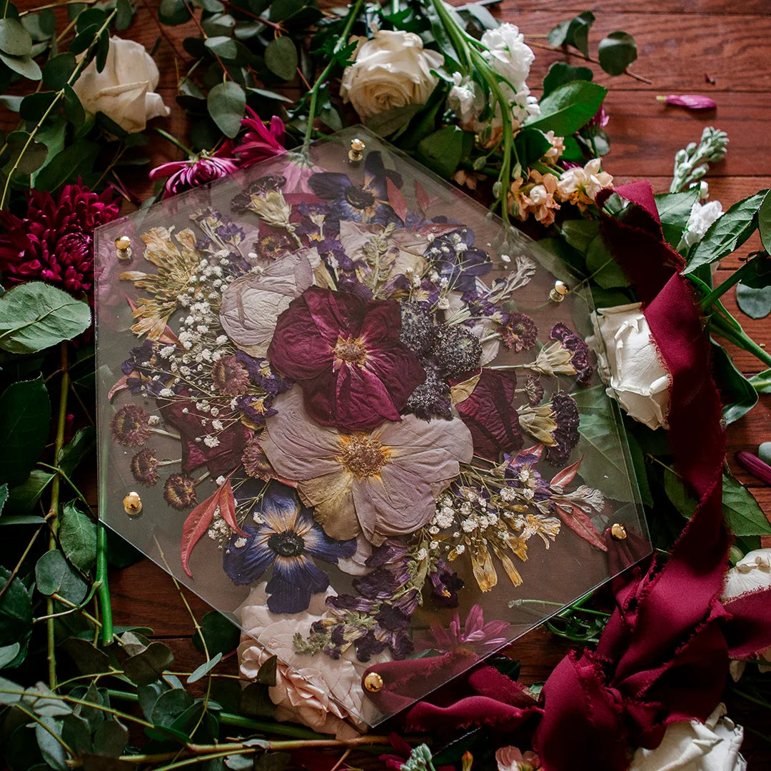 Pressed flower wedding keepsake in a hexagonal glass frame by Oxeye Floral Co