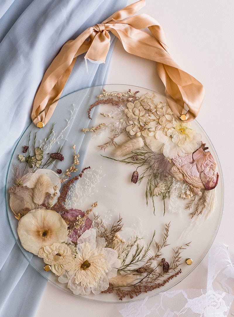 Pressed flower bouquet in a glass floating frame