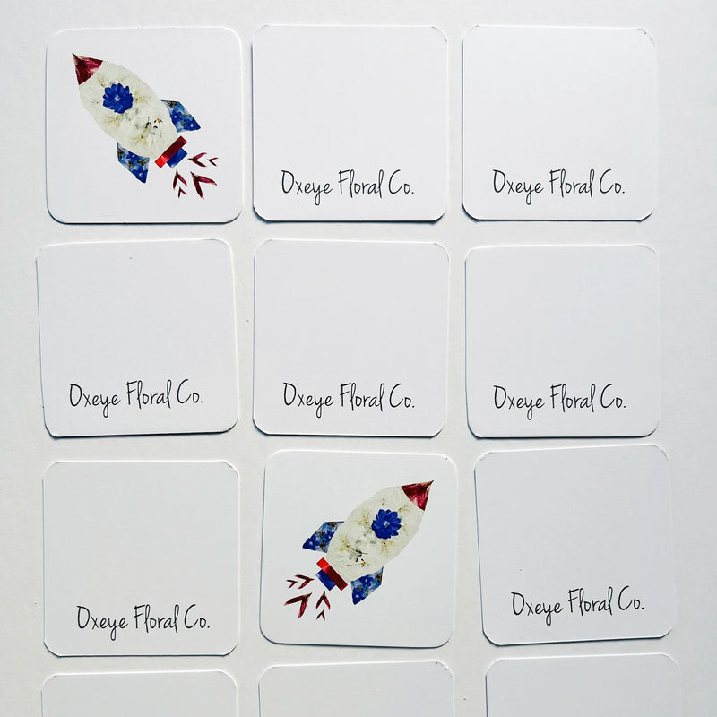 Set of cards with rocket designs and 'Dxeye Floral Co.' text on a white background