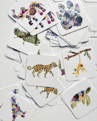 Set of cards with animal and floral designs on a white background