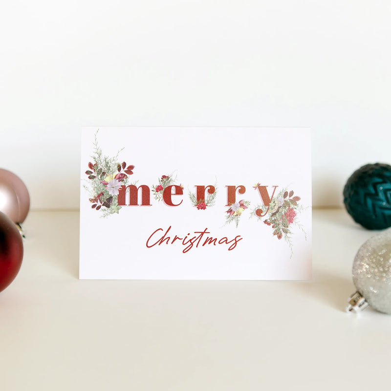dainty floral christmas card with the words "merry christmas"