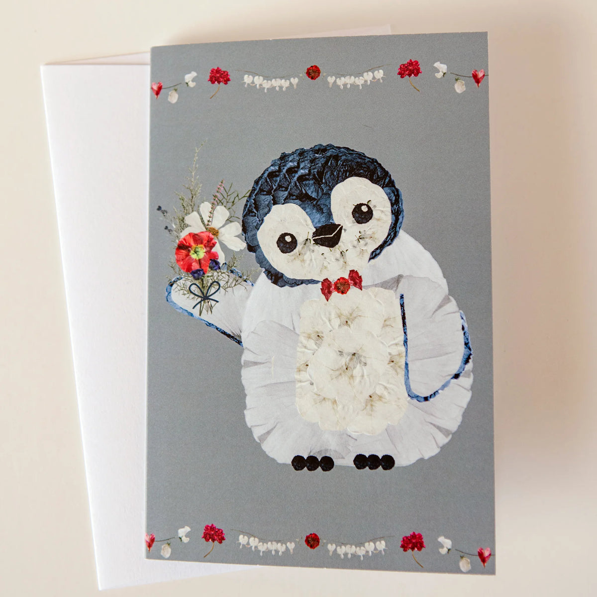 pressed flower penguin greeting card for holiday season