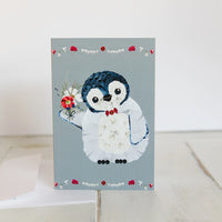 Card with a penguin design on a light gray background