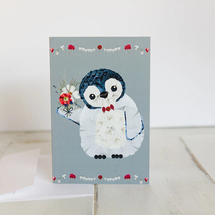 Card with a penguin design on a light gray background