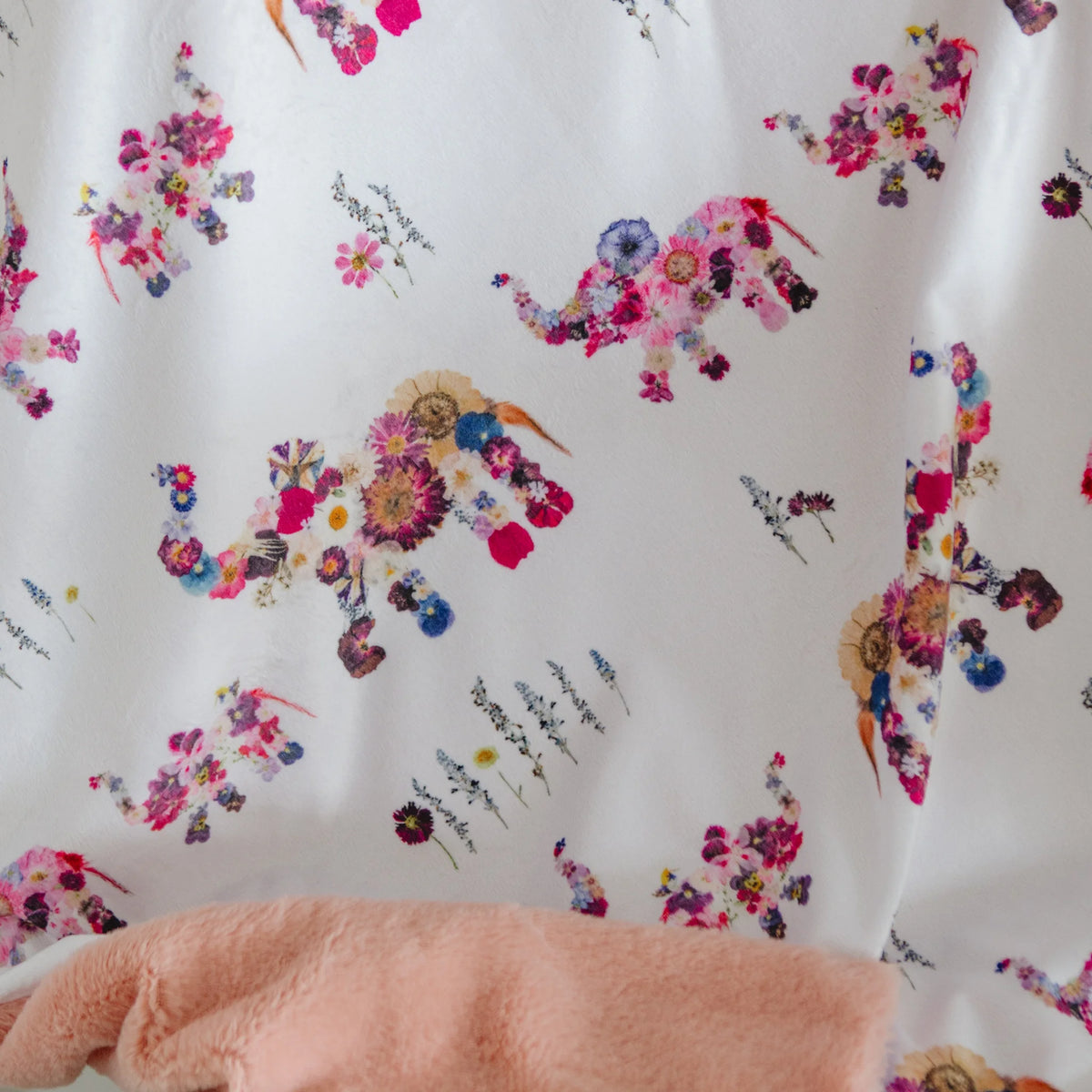 Floral baby blanket with elephants and a pink minky backing