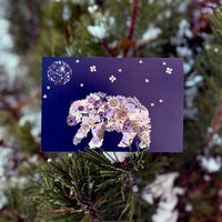 flower bear printed onto a navy blue greeting card