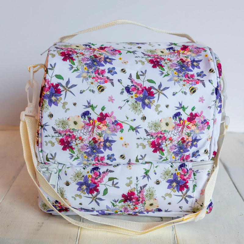 Soft lunch box with a pressed flower and honey bee design