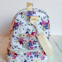 Floral-patterned lunchbox with a white background