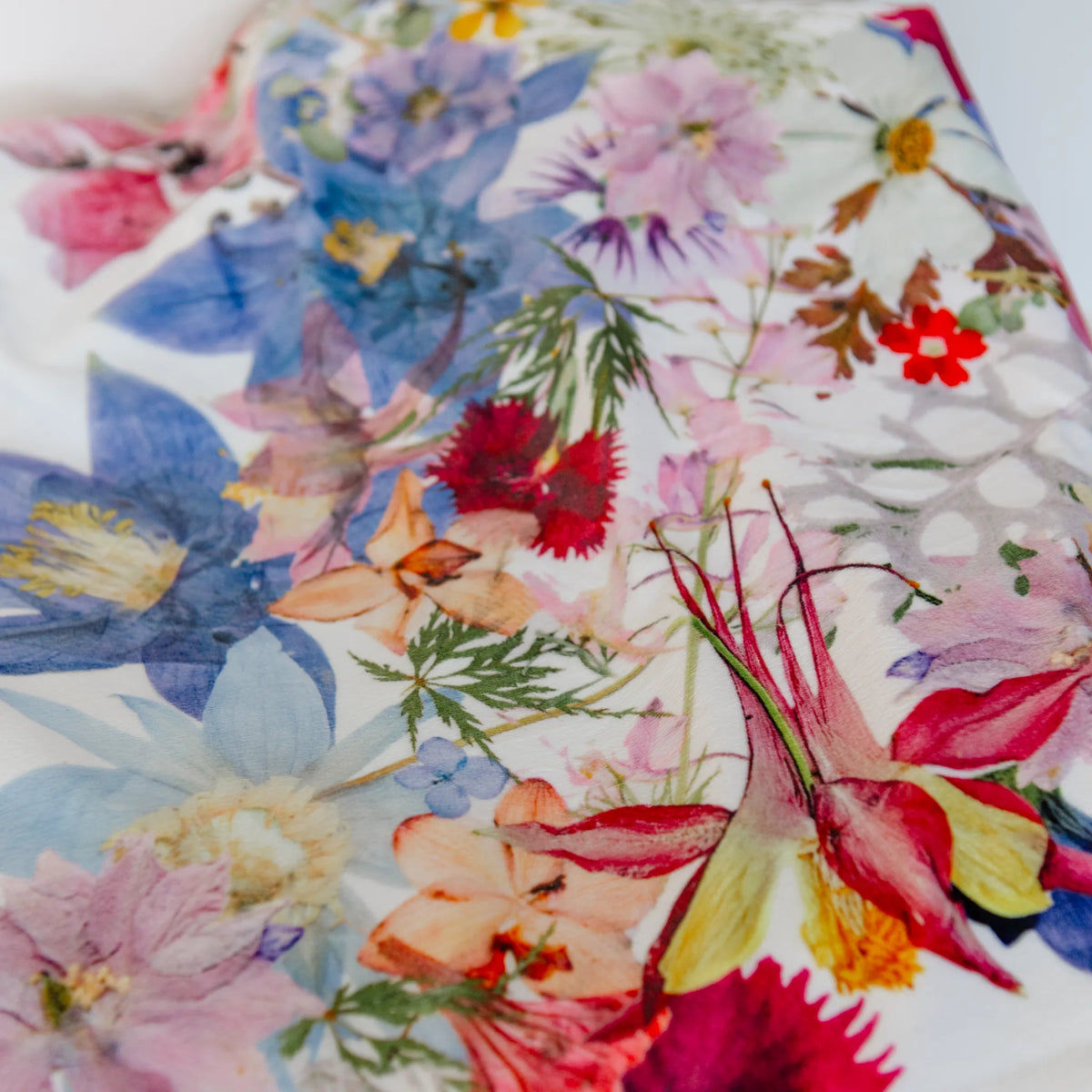 Colorful floral throw blanket with pressed flowers