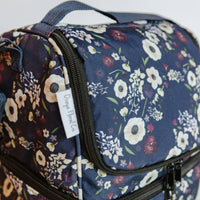 Closeup of zip closures on a floral lunch bag