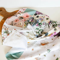 Floral-patterned towel on a wooden surface