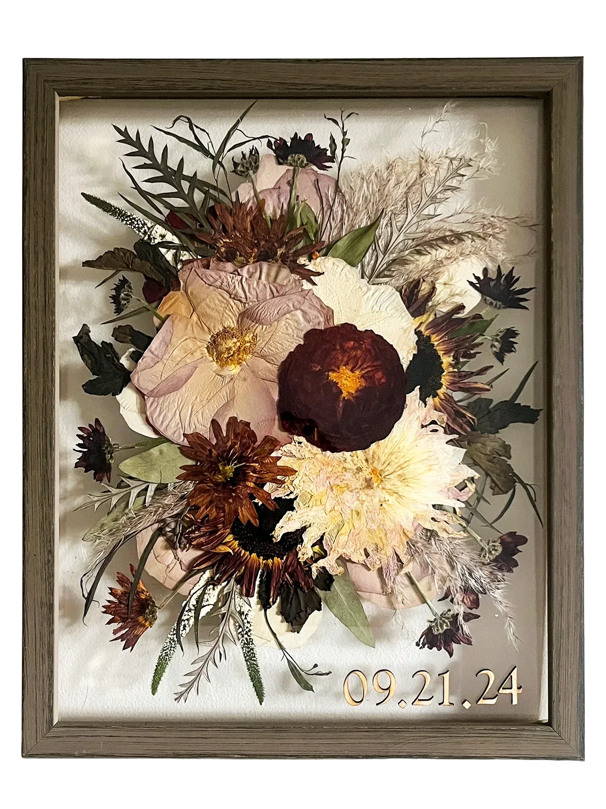 Framed floral arrangement with a date '09.21.24' on a white background