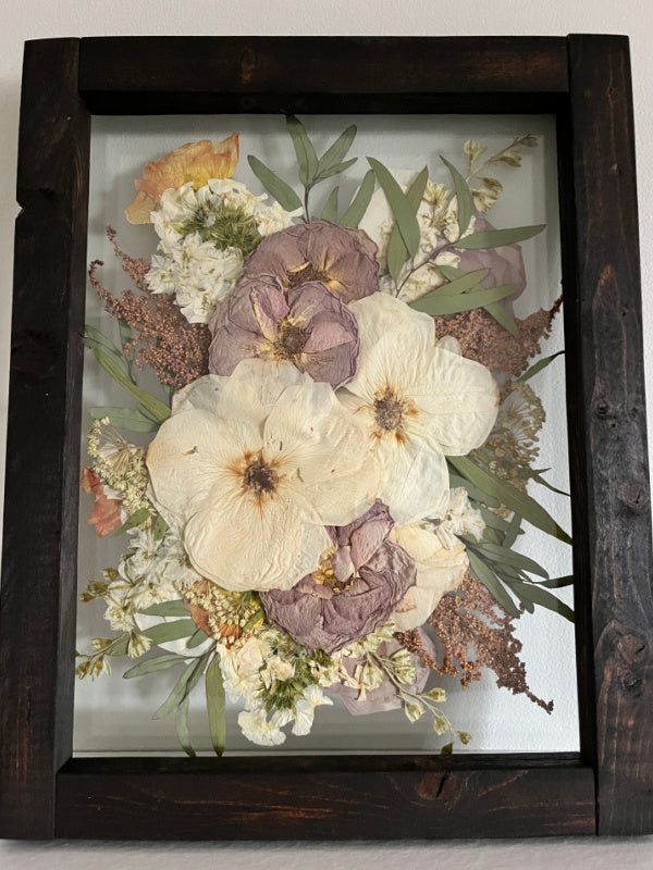 Pressed roses keepsake in a dark wooden frame by Oxeye Floral Co