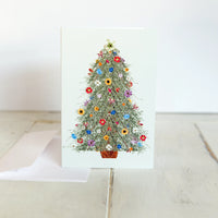 Card with a floral Christmas tree design on a white background