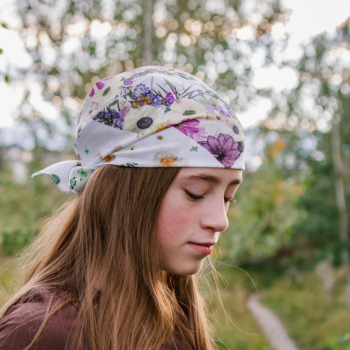 Young woman with pressed flower design bandana on her head
